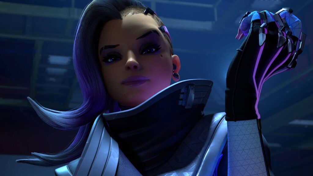 A close-up of the Overwatch character Sombra in a new silver and white outfit, holding a glowing purple orb.