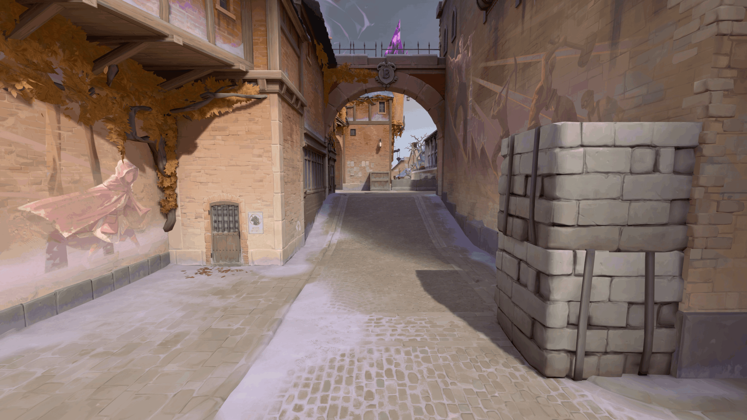 Valorant screenshot of Corrode's reworked mid section showing the new stone half-wall cover on the right side of the lane