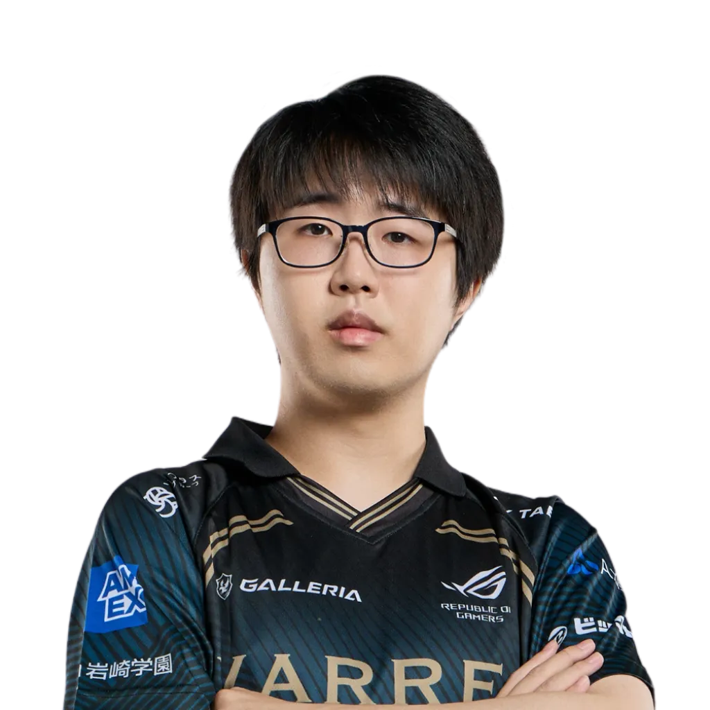 Studio portrait of a VARREL Overwatch player in the team's black and gold jersey with GALLERIA and Republic of Gamers sponsor logos, arms crossed against a black background.